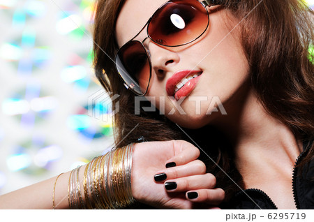 Brunette woman in stylish sunglasses Brunette woman in stylish sunglasses 6295719