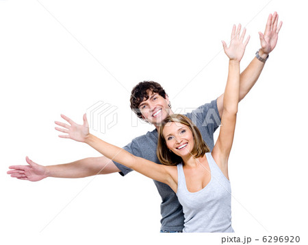 Happy people with the hands lifted upwards Happy people with the hands lifted upwards 6296920