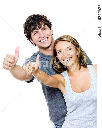 smiling people with thumbs-up gesture smiling people with thumbs-up gesture 6296928