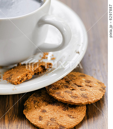 Coffee and oatmeal cookies on wooden table 6297887
