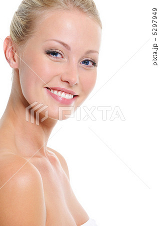 Face of young woman with toothy smile 6297949