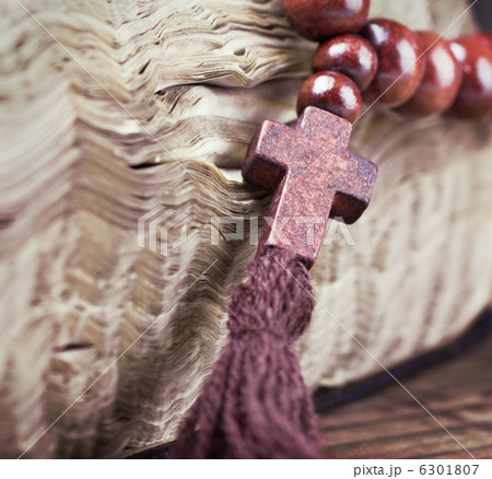 wooden rosary and the Bible 6301807