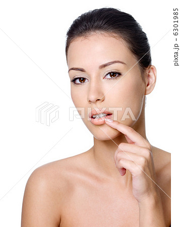 Woman touching her lips Woman touching her lips 6301985