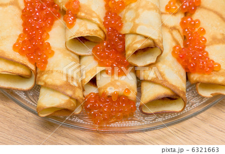 pancakes with red caviar close-up 6321663