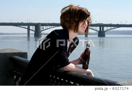 Attractive young woman with bottle of whiskey Attractive young woman with bottle of whiskey 6327174