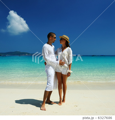 Couple in white on a beach 6327686