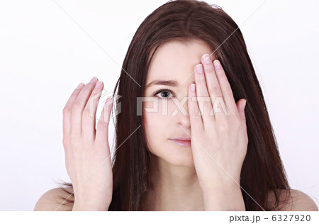 young girl covered her eyes young girl covered her eyes 6327920