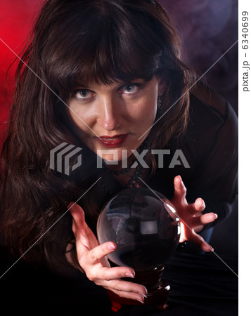 Young woman with crystal ball. Young woman with crystal ball. 6340699