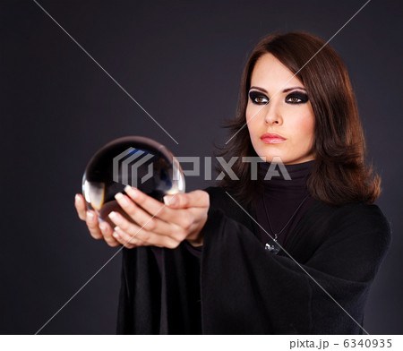 Young woman with crystal ball. Young woman with crystal ball. 6340935