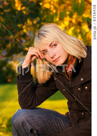Beautiful blond girl on autumn background Beautiful blond girl on autumn background 6356438