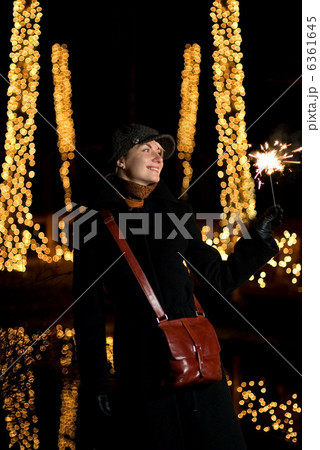 Beautiful happy girl with Christmas fireworks Beautiful happy girl with Christmas fireworks 6361645