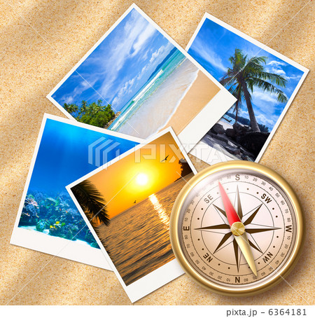 Traveling photos with compass on sand beach 6364181