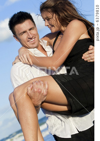 Romantic Couple On Beach With The Man Carrying his Woman Romantic Couple On Beach With The Man Carrying his Woman 6379810