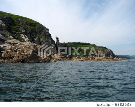 Rocks in the blue sea, illuminated by the sun. Background. Rocks in the blue sea, illuminated by the sun. Background. 6382638