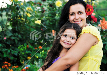 happy mom and daughter outdoor 6382835