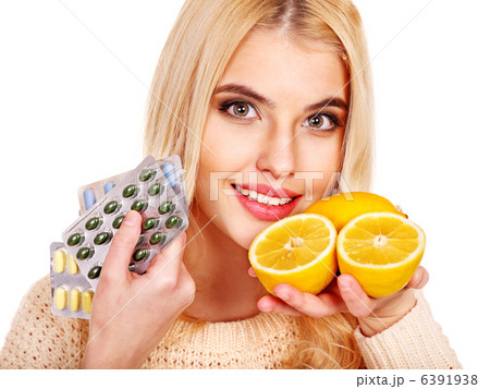 Woman having  tablets and lemon. 6391938