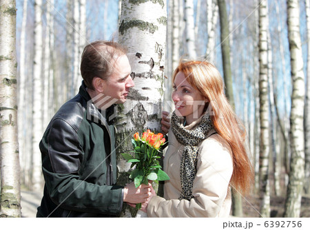 Man gives flowers Man gives flowers 6392756