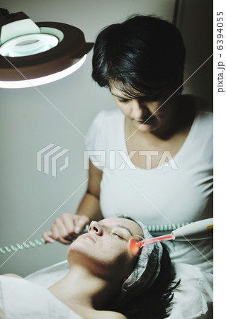 woman with facial mask in cosmetic studio woman with facial mask in cosmetic studio 6394055