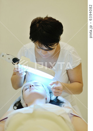 woman with facial mask in cosmetic studio woman with facial mask in cosmetic studio 6394082