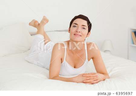 Woman lying on her belly Woman lying on her belly 6395697