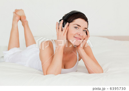 Cute brunette listening to music 6395730