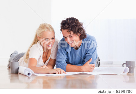 Smiling couple getting ready to move in a new house 6399786