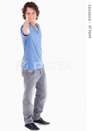 Handsome guy holding thumb up Handsome guy holding thumb up 6400492