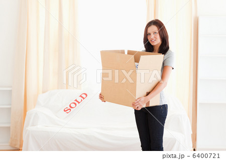 Woman holding full cardboard Woman holding full cardboard 6400721