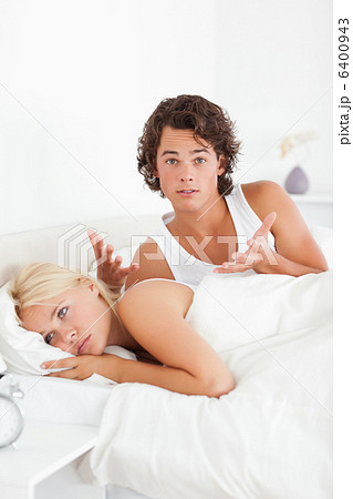 Portrait of an upset man arguing with his fiance 6400943