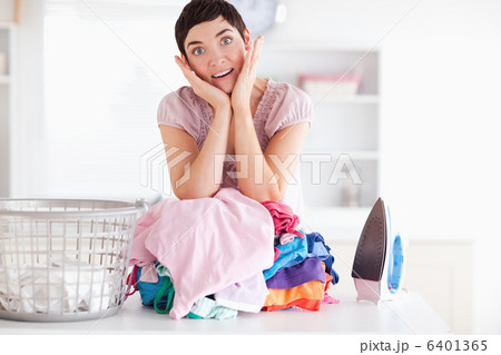Surprised Woman with a pile of clothes 6401365