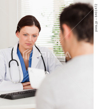 Female doctor and a patient reading prescription Female doctor and a patient reading prescription 6401472