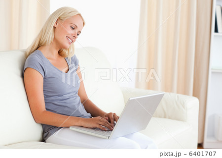Serene woman using a laptop 6401707