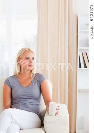 Portrait of a woman having a tea Portrait of a woman having a tea 6401975