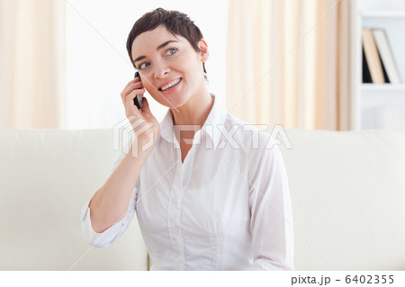 Joyful woman with a cellphone 6402355