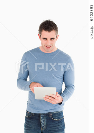 Portrait of a man using a tablet computer 6402395