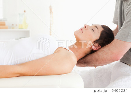 Woman relaxing during a massage 6403284