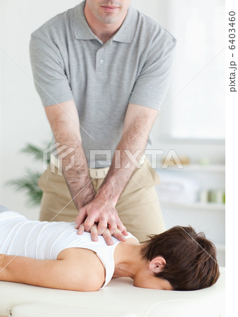 Handsome Man massaging a cute womans neck 6403460