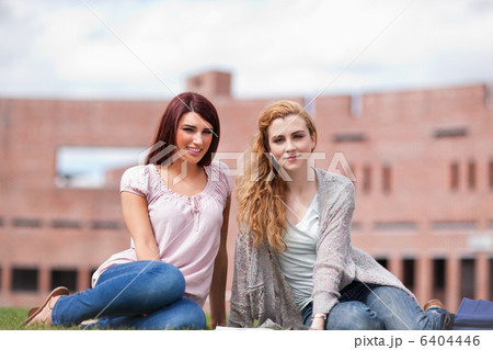 Young students with a book 6404446