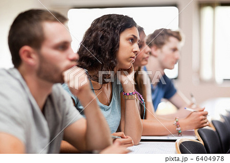 Students listening a lecturer Students listening a lecturer 6404978