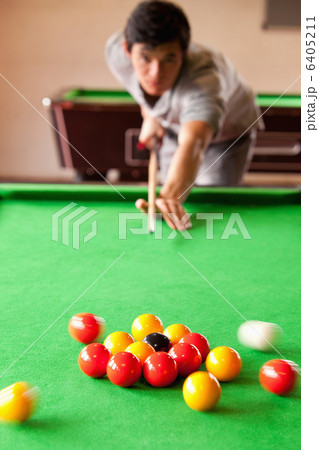 Portrait of a man starting a pool game 6405211