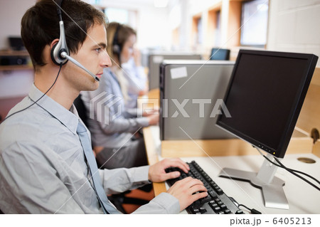 Serious operator using a computer Serious operator using a computer 6405213