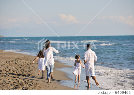 happy young family have fun on beach happy young family have fun on beach 6409465