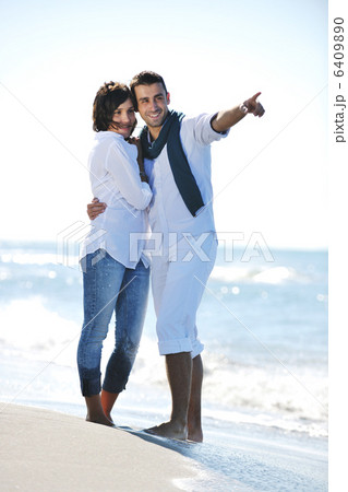 happy young couple have fun at beautiful beach 6409890