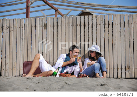 young couple enjoying picnic on the beach 6410271