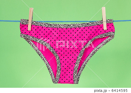 Pink panties on the green background Pink panties on the green background 6414595