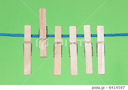 Clothes pegs  on the green background 6414597