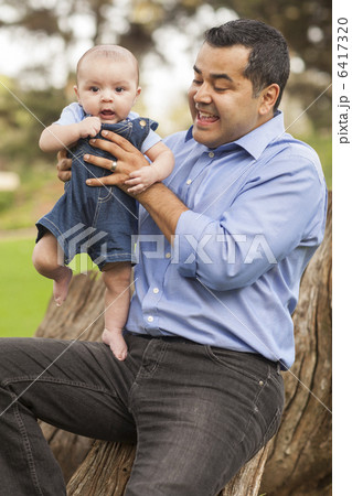 Handsome Hispanic Father and Son Posing for A Portrait Handsome Hispanic Father and Son Posing for A Portrait 6417320