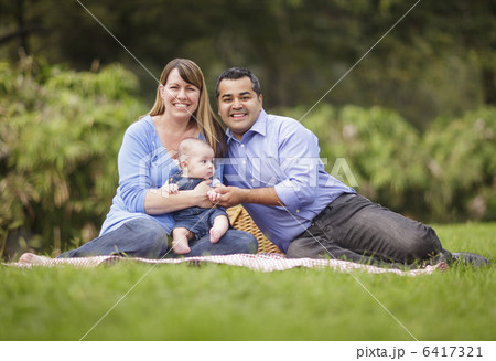 Happy Mixed Race Family Playing In The Park 6417321