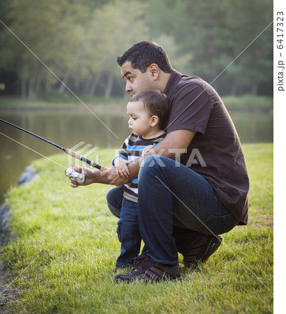 Happy Young Ethnic Father and Son Fishing Happy Young Ethnic Father and Son Fishing 6417323