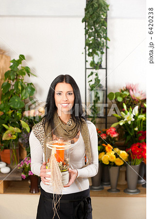 Female florist in flower shop Female florist in flower shop 6420238